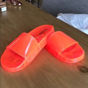 Cape Robbin neon pink jelly slides